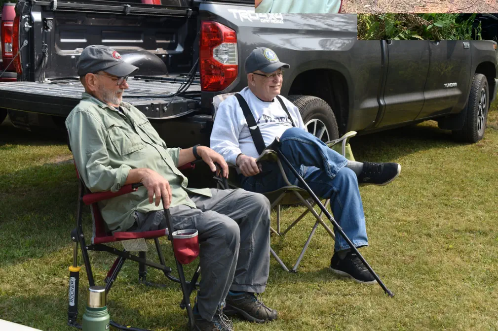 two men sitting in chairs