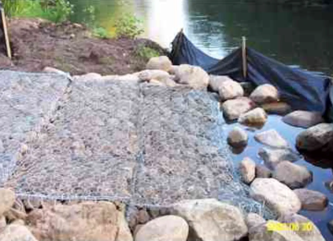Netting installed to help stabilize hill Netting installed to help stabilize hill
