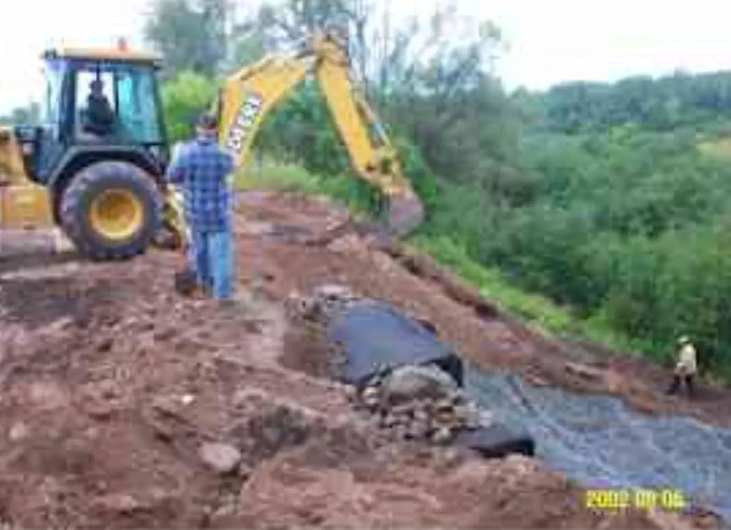 Backhoe on top of hill Backhoe on top of hill