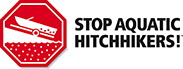 Stop Aquatic Hitchhikers with stop sign of boat on boat ramp Stop Aquatic Hitchhikers with stop sign of boat on boat ramp